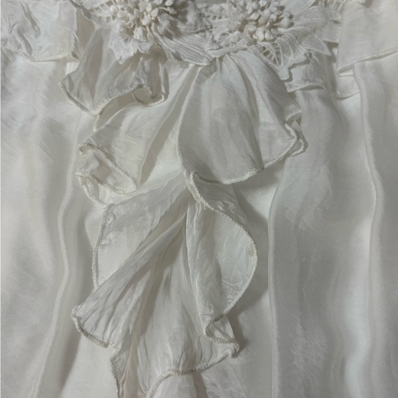 White silk made in Italy blouse. 3D flowers at v neckline. Ruffle front. - Picture 13 of 15